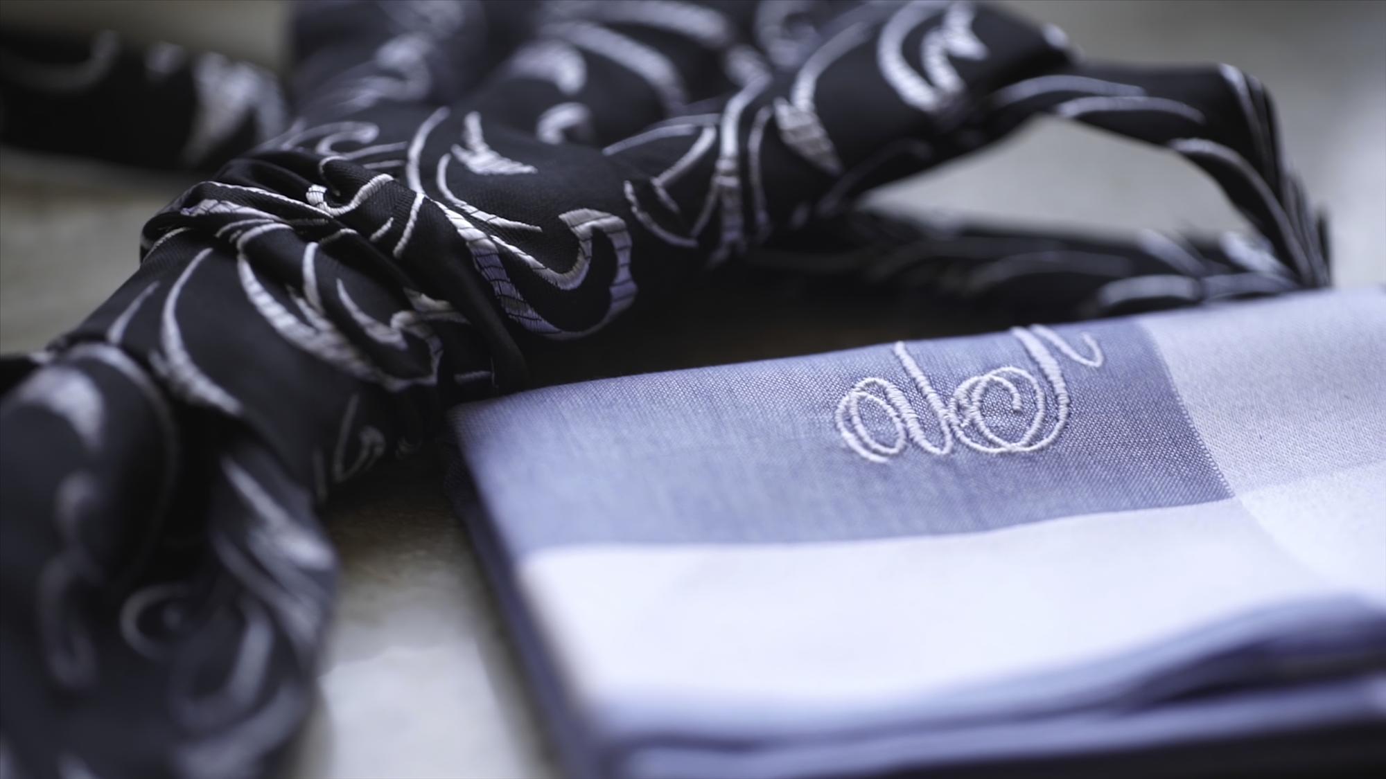 Close-up luxury embroidered monogram on silk